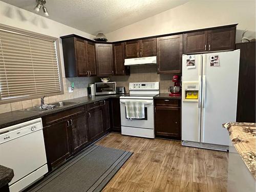 5402 44 Avenue, Taber, AB - Indoor Photo Showing Kitchen With Double Sink