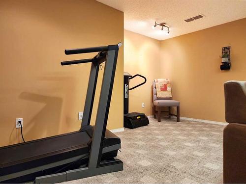 3805 Redwood Road South, Lethbridge, AB - Indoor Photo Showing Gym Room