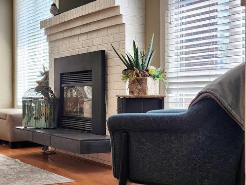 3805 Redwood Road South, Lethbridge, AB - Indoor Photo Showing Living Room With Fireplace