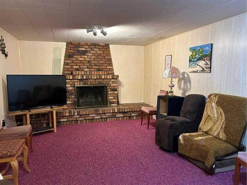 1222 12C Street North, Lethbridge, AB - Indoor Photo Showing Living Room With Fireplace