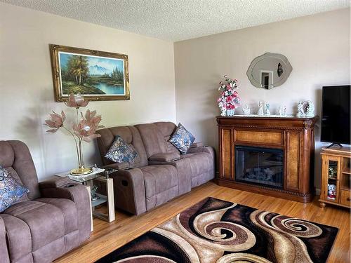 1222 12C Street North, Lethbridge, AB - Indoor Photo Showing Living Room With Fireplace