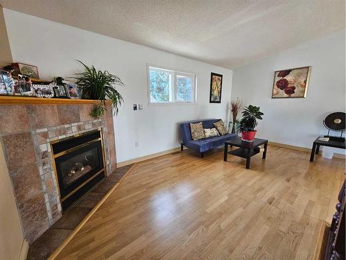 437 Main Street, Milk River, AB - Indoor Photo Showing Living Room With Fireplace