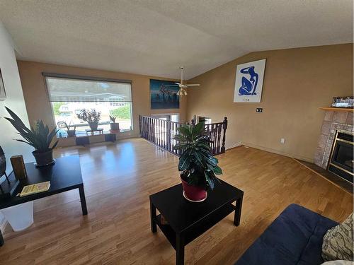 437 Main Street, Milk River, AB - Indoor Photo Showing Living Room With Fireplace