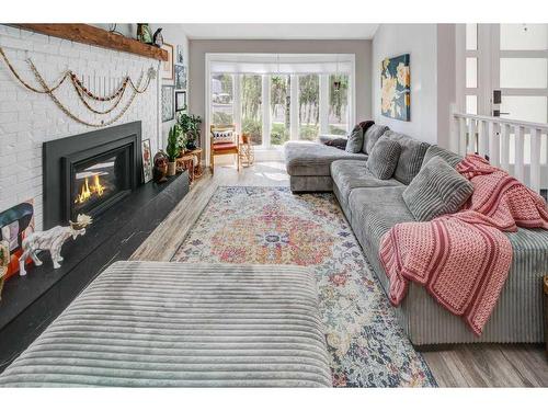 31 Erminerun Place North, Lethbridge, AB - Indoor Photo Showing Living Room With Fireplace