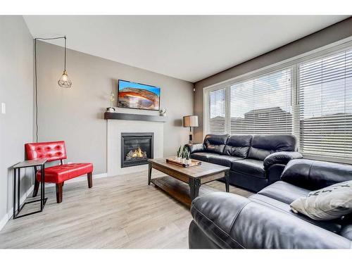 893 Atlantic Cove West, Lethbridge, AB - Indoor Photo Showing Living Room With Fireplace