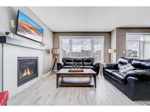 893 Atlantic Cove West, Lethbridge, AB - Indoor Photo Showing Living Room With Fireplace