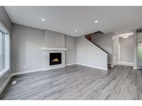 4401 40 Avenue South, Lethbridge, AB - Indoor Photo Showing Other Room With Fireplace