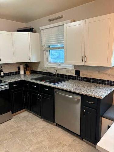 805 27 Street North, Lethbridge, AB - Indoor Photo Showing Kitchen With Double Sink