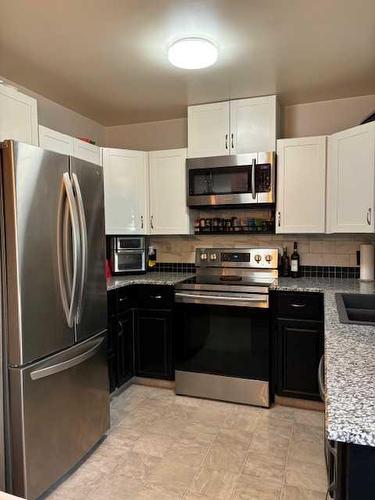 805 27 Street North, Lethbridge, AB - Indoor Photo Showing Kitchen With Double Sink