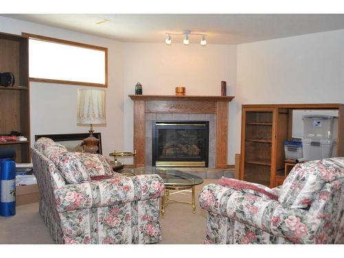 54 Cougar Road North, Lethbridge, AB - Indoor Photo Showing Living Room With Fireplace