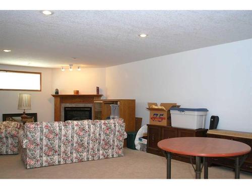 54 Cougar Road North, Lethbridge, AB - Indoor With Fireplace