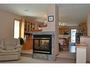 54 Cougar Road North, Lethbridge, AB  - Indoor Photo Showing Living Room With Fireplace 