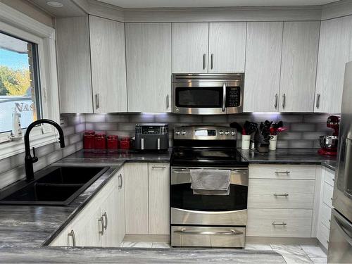 2218 6A Avenue North, Lethbridge, AB - Indoor Photo Showing Kitchen With Double Sink