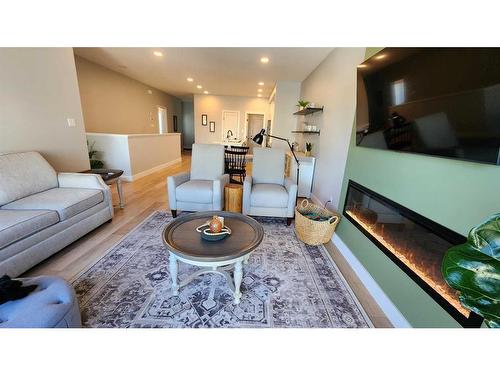 4617 26 Avenue South, Lethbridge, AB - Indoor Photo Showing Living Room With Fireplace