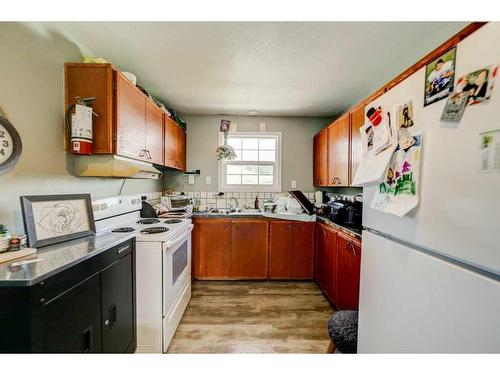 8636 19 Avenue, Coleman, AB - Indoor Photo Showing Kitchen With Double Sink