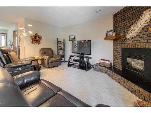 22 Mt Royal Place West, Lethbridge, AB - Indoor Photo Showing Living Room With Fireplace