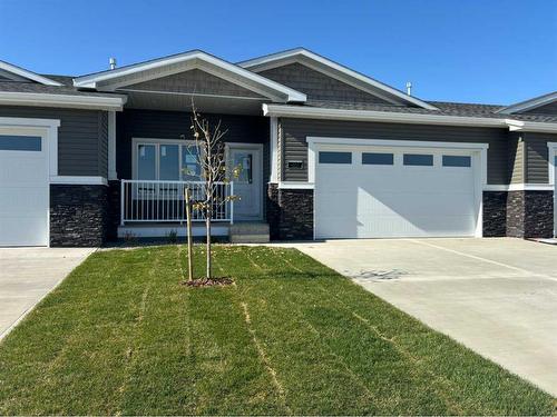 202-1940 Parkside Way, Coaldale, AB - Outdoor With Facade