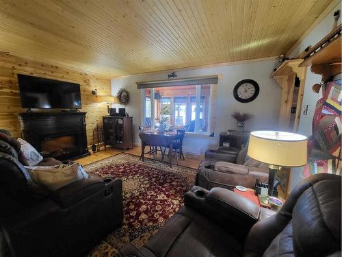 9 Mountain Vista Drive, Hill Spring, AB - Indoor Photo Showing Living Room With Fireplace