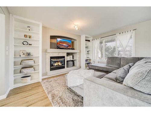 141 Peigan Court West, Lethbridge, AB - Indoor Photo Showing Living Room With Fireplace