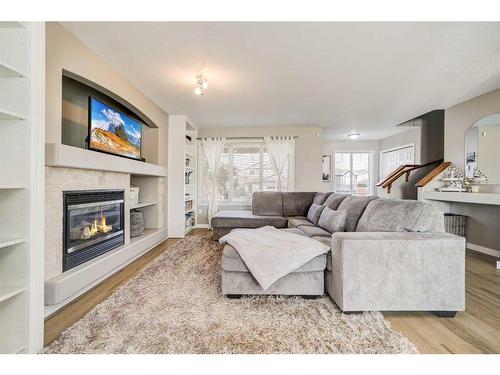 141 Peigan Court West, Lethbridge, AB - Indoor Photo Showing Living Room With Fireplace