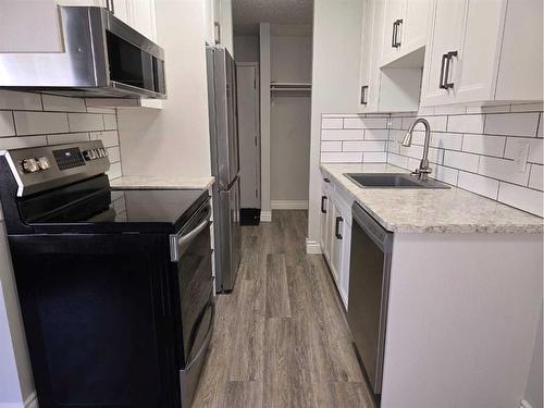 12-3410 23 Avenue South, Lethbridge, AB - Indoor Photo Showing Kitchen With Stainless Steel Kitchen With Upgraded Kitchen