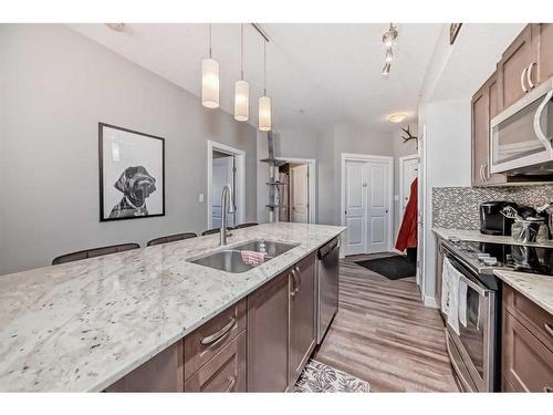 1108-3727 Sage Hill Drive Nw, Calgary, AB - Indoor Photo Showing Kitchen With Double Sink With Upgraded Kitchen