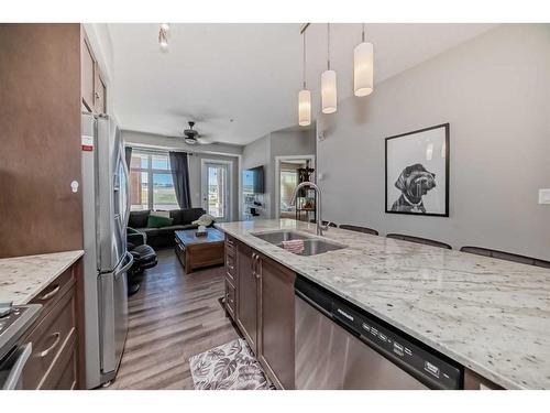 1108-3727 Sage Hill Drive Nw, Calgary, AB - Indoor Photo Showing Kitchen With Double Sink With Upgraded Kitchen