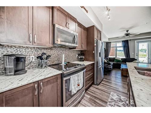 1108-3727 Sage Hill Drive Nw, Calgary, AB - Indoor Photo Showing Kitchen With Upgraded Kitchen