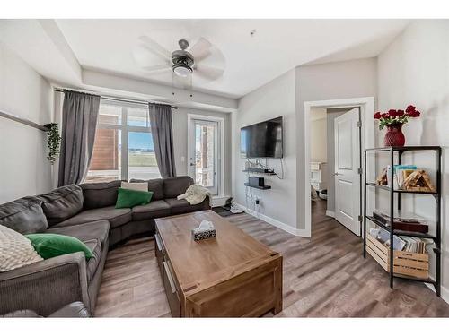 1108-3727 Sage Hill Drive Nw, Calgary, AB - Indoor Photo Showing Living Room