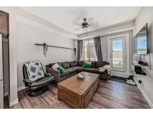 1108-3727 Sage Hill Drive Nw, Calgary, AB - Indoor Photo Showing Living Room