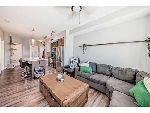 1108-3727 Sage Hill Drive Nw, Calgary, AB - Indoor Photo Showing Living Room