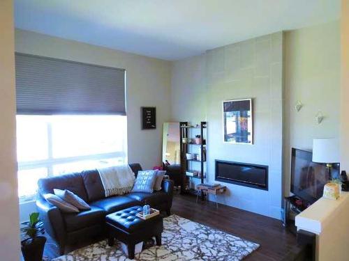 354 Uplands Boulevard North, Lethbridge, AB - Indoor Photo Showing Living Room With Fireplace