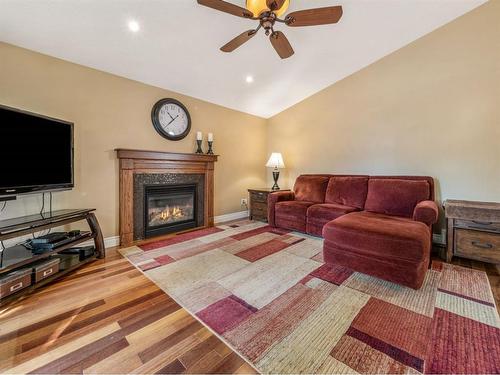 10 Couleesprings Place South, Lethbridge, AB - Indoor Photo Showing Living Room With Fireplace