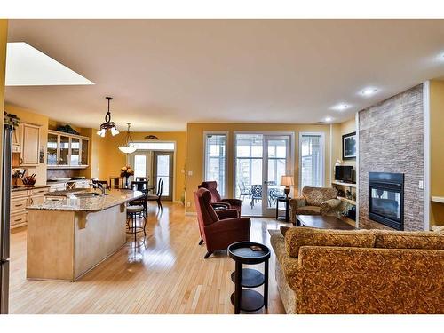 1203 Whispering Greens Place, Vulcan, AB - Indoor Photo Showing Living Room With Fireplace