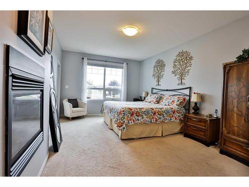 1203 Whispering Greens Place, Vulcan, AB - Indoor Photo Showing Bedroom