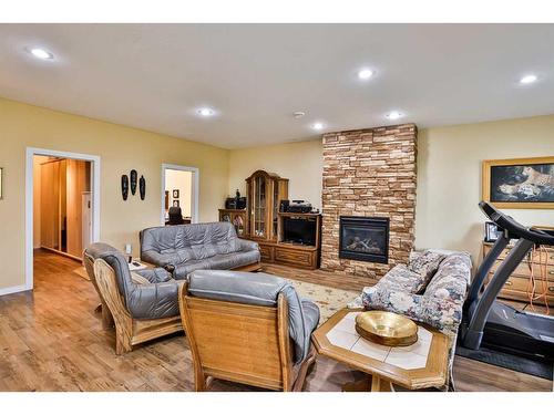 1203 Whispering Greens Place, Vulcan, AB - Indoor Photo Showing Living Room With Fireplace