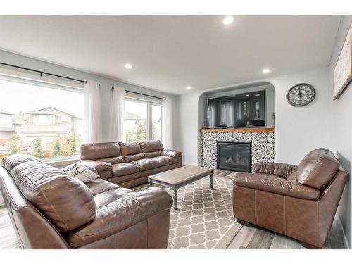 214 Stonecrest Bay West, Lethbridge, AB - Indoor Photo Showing Living Room With Fireplace