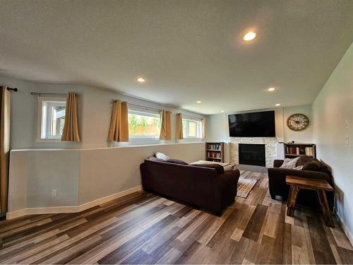 214 Stonecrest Bay West, Lethbridge, AB - Indoor Photo Showing Living Room With Fireplace