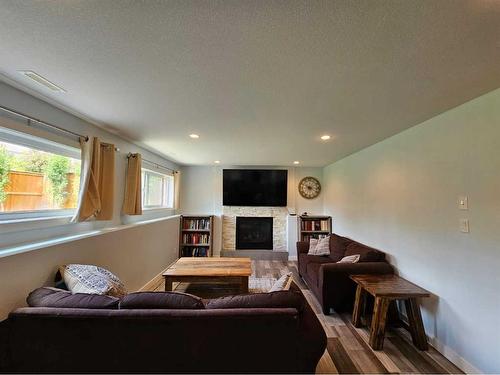 214 Stonecrest Bay West, Lethbridge, AB - Indoor Photo Showing Living Room With Fireplace