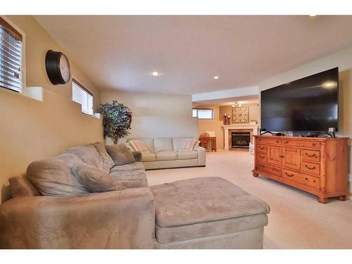 310 Squamish Court West, Lethbridge, AB - Indoor Photo Showing Living Room With Fireplace