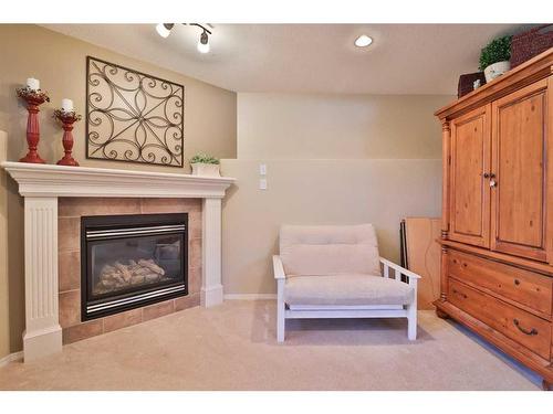 310 Squamish Court West, Lethbridge, AB - Indoor Photo Showing Living Room With Fireplace