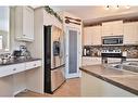 310 Squamish Court West, Lethbridge, AB  - Indoor Photo Showing Kitchen With Stainless Steel Kitchen With Double Sink With Upgraded Kitchen 