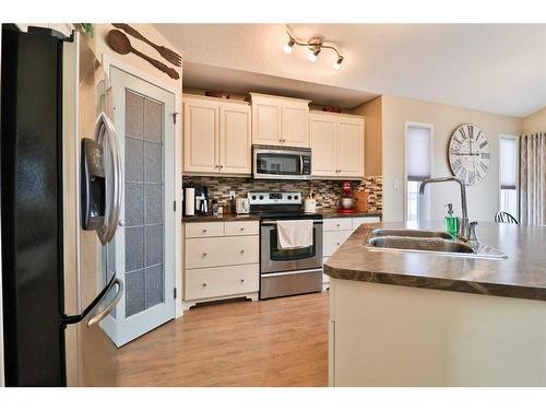 310 Squamish Court West, Lethbridge, AB - Indoor Photo Showing Kitchen With Stainless Steel Kitchen With Double Sink