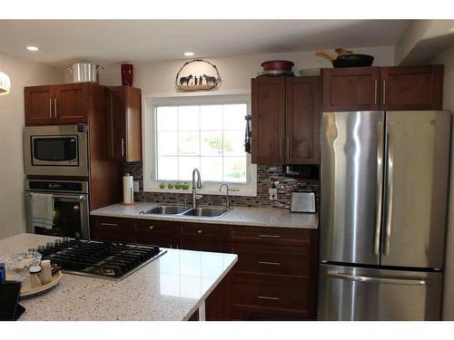 601 Rogers Avenue, Picture Butte, AB - Indoor Photo Showing Kitchen With Double Sink