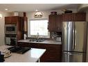 601 Rogers Avenue, Picture Butte, AB  - Indoor Photo Showing Kitchen With Double Sink 