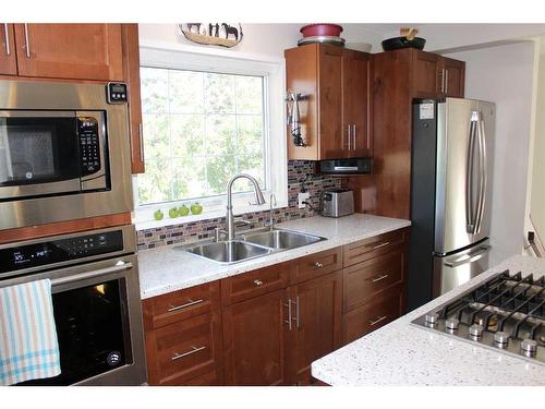 601 Rogers Avenue, Picture Butte, AB - Indoor Photo Showing Kitchen With Double Sink