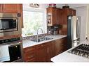 601 Rogers Avenue, Picture Butte, AB  - Indoor Photo Showing Kitchen With Double Sink 