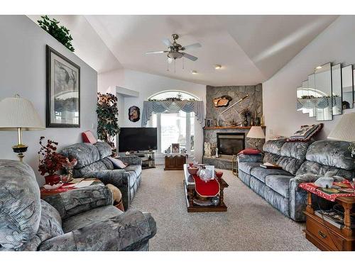 102 Fairmont Cove South, Lethbridge, AB - Indoor Photo Showing Living Room With Fireplace