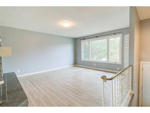 59 Laval Boulevard West, Lethbridge, AB - Indoor Photo Showing Other Room With Fireplace