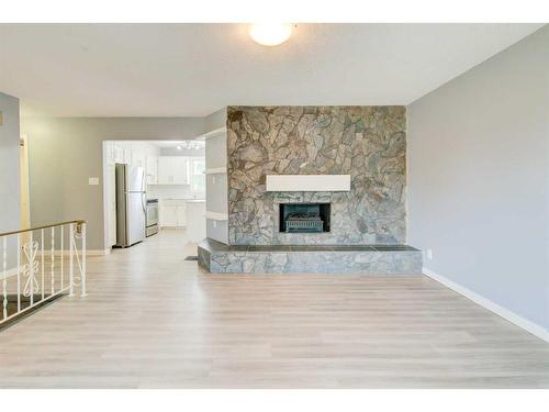 59 Laval Boulevard West, Lethbridge, AB - Indoor Photo Showing Living Room With Fireplace